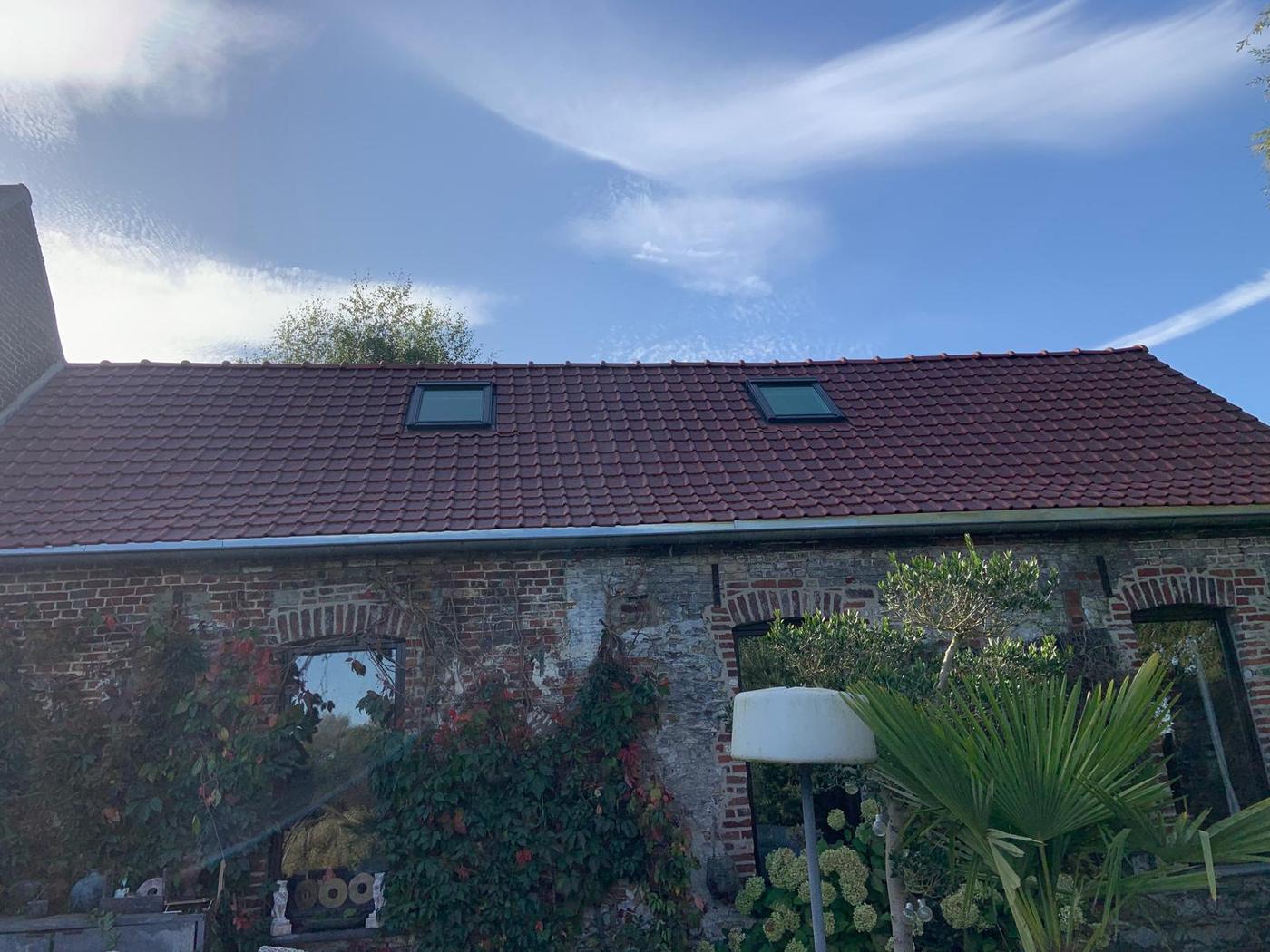 Renovated tiled roof with roof windows